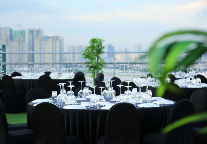 Place settings for dinner on the roof of Caravelle Luxury Hotel in district 1 Saigon