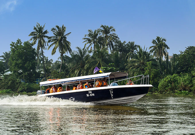 Explore the Mekong Delta by boat as part of Caravelle's selection of experiences in Vietnam